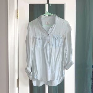 Baby blue button down shirt.